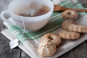 Hot tea and   butter cookies on table