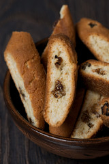 biscotti with raisins in a bowl, vertical