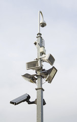 Security lights and cameras on a post