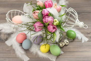 pink tulip flowers and easter eggs