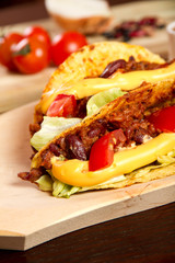 Tacos on a wooden plate