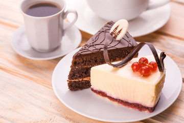 delicious chocolate and cheesecake with cup of coffee