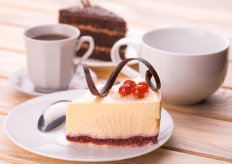 delicious chocolate and cheesecake with cup of coffee
