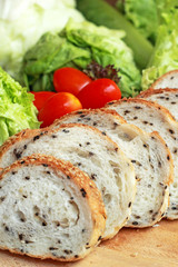 bread sprinkled with sesame -  vegetable green salad