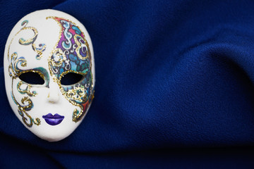 Beautiful mask on heavy dark blue fabric