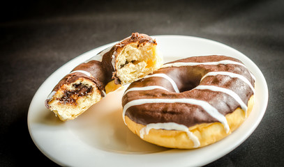 Chocolate donuts with a cup of coffee