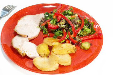 baked potato salad and pork in a red plate