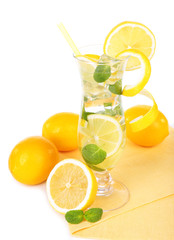 Fototapeta premium Glass of cocktail with lemon and mint isolated on white