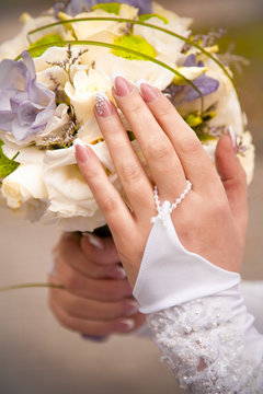 Closeup shot of bride holding wedding bouquet