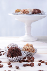 Set of chocolate candies on table on light background