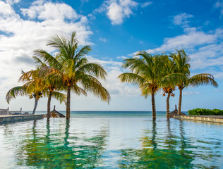 Naklejka na ściany i meble swimming pool in tropical beach