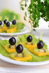 Delicious canapes on table close-up