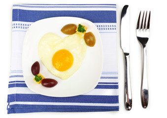 Scrambled eggs with bread on plate, on color napkin