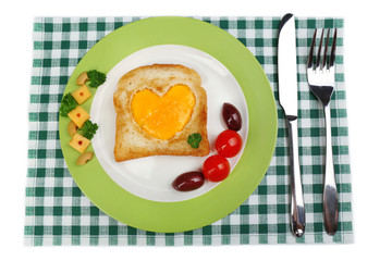 Scrambled eggs with bread on plate, on color napkin