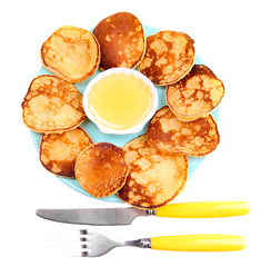 Fried pancakes on color plate, isolated on white