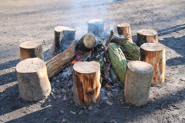 A Large Outdoor Wooden Log Warming Bonfire.