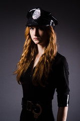 Woman police office in dark room