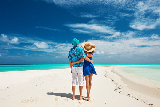 Couple in blue on a beach at Maldives