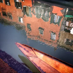 Foto op Plexiglas Venice, a wooden boat in a canal © Tatiana Zaghet