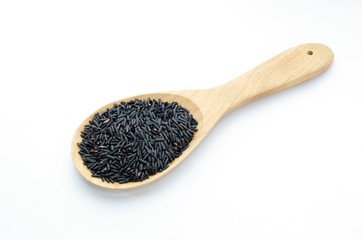 Rice berry on a wooden ladle. On a white background.