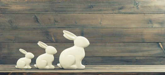 easter bunnies over wooden background