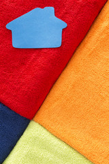 Vivid geometric pattern of towels with a home icon