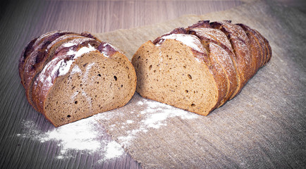 Fresh Tasty Bread on Woody Background