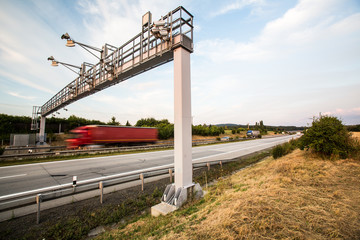 truck passing through a toll gate on a highway