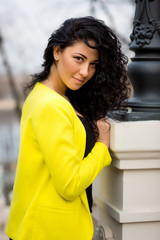 Beautiful Woman in warm autumn day on staircase