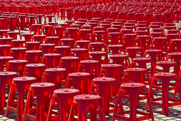 Fototapeta premium Empty red plastic chairs
