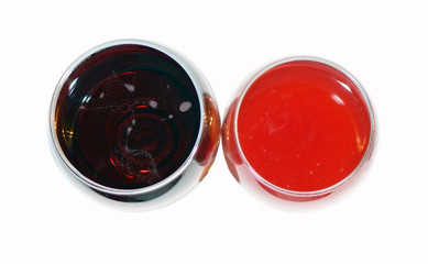 two glasses with drinks on a white background