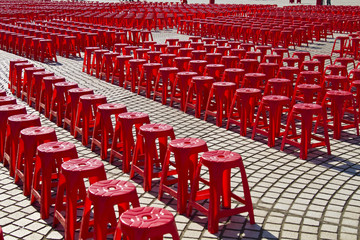 Empty red plastic chairs