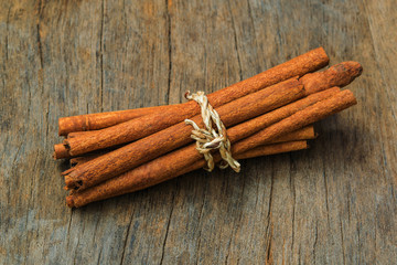 Cinnamon  on wood background
