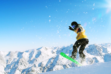 Fototapeta na wymiar Snowboarder in jump