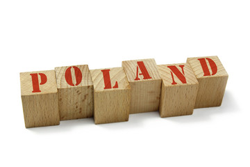 Poland word on wood cubes isolated on white background © chrupka