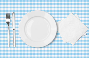 plate, fork, knife and napkin over blue checked fabric tableclot