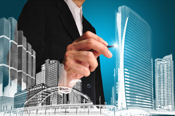 Business man or achitect draw the drawing of building or citysca