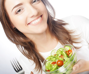 Smiling girl with a salad