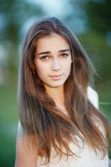 Naklejka premium beautiful girl with long hair portrait