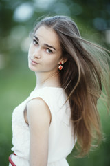Naklejka premium beautiful girl with long hair portrait
