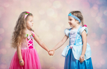 First friend. Portrait of two little girls holding hands