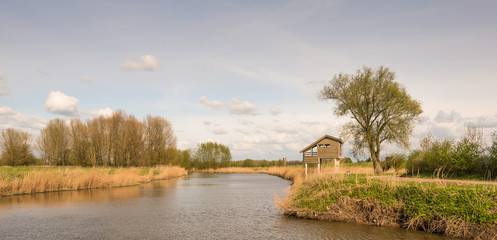 Obraz premium Wooden bird watching hut on concrete piles