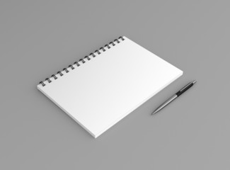 Noitzblock mit Kugelschreiber Hintergrund grau