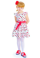 Charming little girl standing leg thrust forward and have fun lo