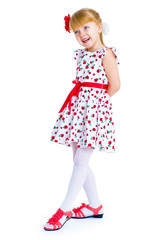 Charming little girl standing leg thrust forward and have fun lo