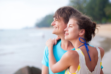 front view of young couple flirting on beach