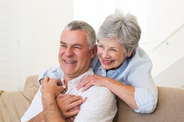 Retired couple embracing