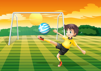 Fototapeta premium A female player kicking the ball with the flag of Greece
