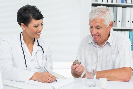 Doctor explaining reports to male patient