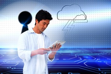 Casual man using tablet with cloud graphic